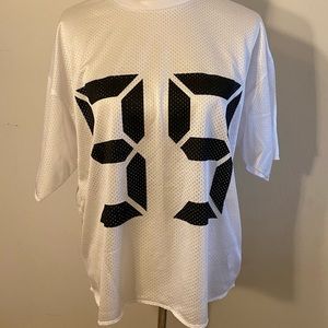 White top with number 99